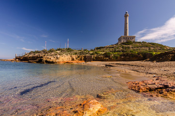Fototapeta premium Faro de Cabo de Palos, located on a small peninsula in Cartagena (Murcia) Spain