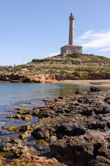 Fototapeta premium Faro de Cabo de Palos, located on a small peninsula in Cartagena (Murcia) Spain