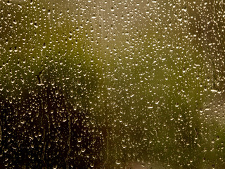 Rain drops on a glass texture, Green and dark tones, Random pattern.