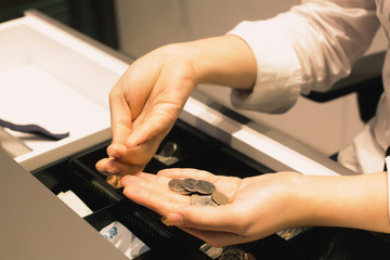 Employees are counting on the shop for customers to buy Woman's hand