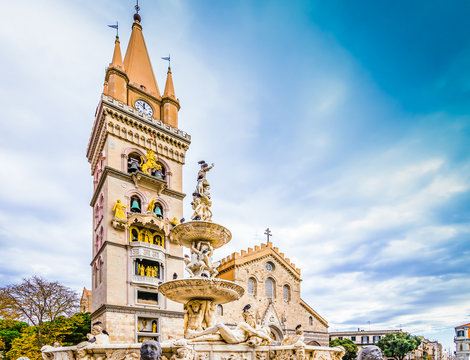 Roman Catholic cathedral and Orion fountain on the main square of Messina, Sicily, Italy.