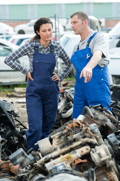 portrait of workers on a junkyard