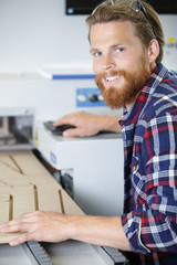 young man working in carpenting studio