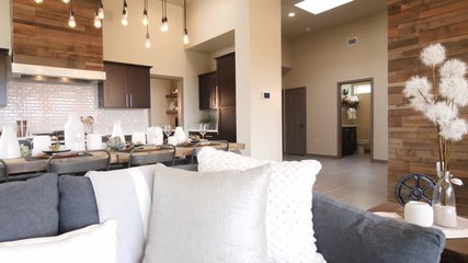 Kitchen Reveal from In Front Of Couch Tilt Down. view rises and reveals wide shot of kitchen from in front of couch in open concept living