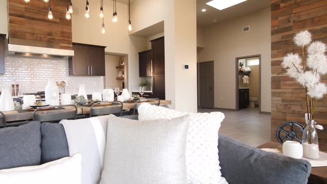 Kitchen Reveal from In Front Of Couch Tilt Down. view rises and reveals wide shot of kitchen from in front of couch in open concept living