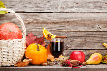 Autumn still life with mulled wine and pumpkins