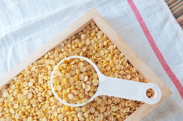 Yellow Dried Soybeans in A Measuring Spoon