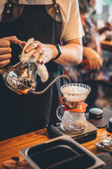 Barista making drip coffee in coffee shop, barista cafe making coffee, coffee maker