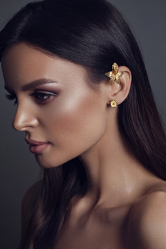 Beautiful young woman with kaffa in the ear. Make up and Jewellery concept - Image