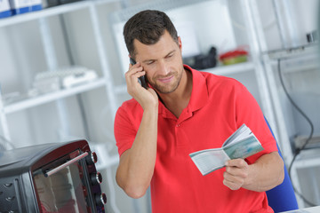 technician reading the instruction manual