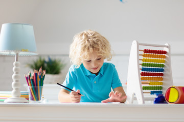 Child with abacus doing homework after school.