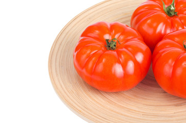 Three red ripe tomato beef. Studio Photo