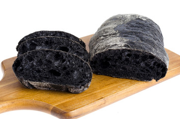 Black bread with cuttlefish ink. Studio Photo