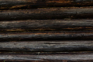 Fototapeta na wymiar Wooden wall of logs texture background old