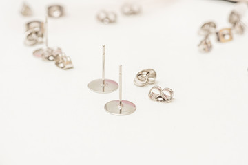 Assortment of jewelry metal ear studs.