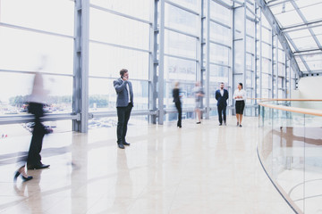 Business people walking in hall