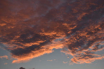 Cloudy sky at sunset in summer.