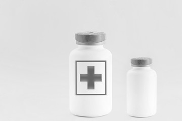 Two empty pill bottles. The white background, modern medicine used for the prevention and treatment of diseases, copies the space.