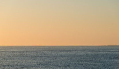 Calm sea at a beautiful orange sunset.