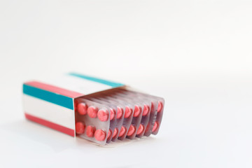 Tablets in blister pack, medicines, white background, macro, selective focus, copy space