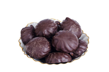 Delicious marshmallows in chocolate on plate. Image on white background.