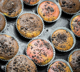Yummy, hot muffins on a baking plate.