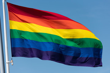 Rainbow flag waving in the breeze.