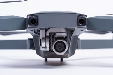 Camera and gimbal of a grey drone.