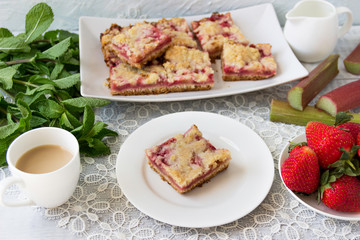 Homemade cake with fresh strawberries and rhubarb.
