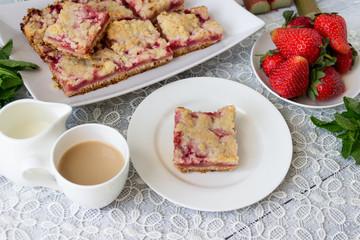 Homemade cake with fresh strawberries and rhubarb.