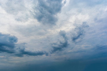 Dark storm clouds in the sky. Blurring background. Bright colors.