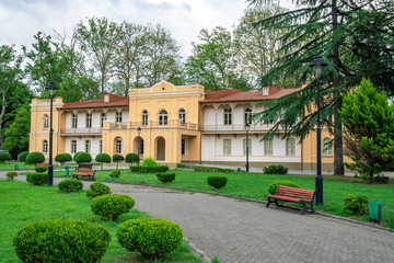 Fototapeta na wymiar museum building next to the Dadiani palace in a park in Zugdidi.