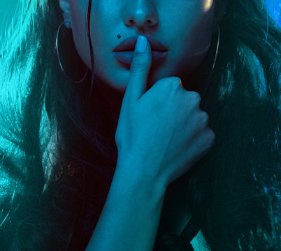 Sensual woman neon light half portrait. Beautiful young female model in neon light image