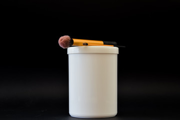 A bottle of household chemicals cosmetics on a black background neck of a bottle close up macro...