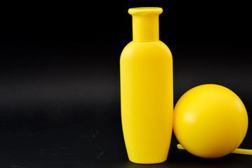 A bottle of household chemicals cosmetics on a black background neck of a bottle close up macro pattern