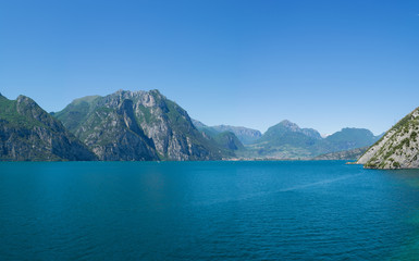 Fototapeta na wymiar Beautiful panoramic view of Lago Di Garda coastline. Riva Del Garda and Nago-Torbole towns, Italy