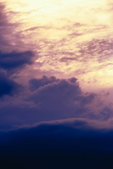 dark blue clouds at pink sunset