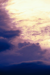 dark blue clouds at pink sunset