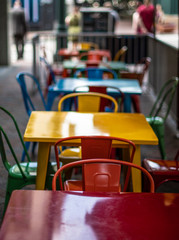 Colorful chairs and tables on restaurant patio