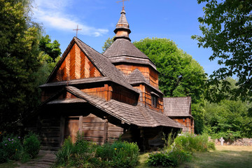 Old wooden orthodox church. Ukrainian church of the nineteenth century. Summer landscape, sunshine. Village Pirogovo.