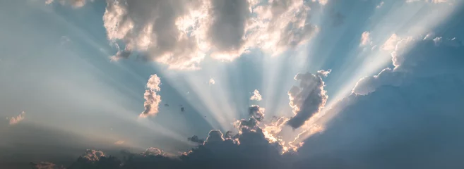 Muurstickers Epic cloudy sky holy sun light beams © Eneko Aldaz