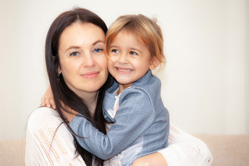 happy mother with her daughter in the room