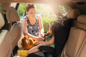 Cute little baby child sitting in car seat. Portrait of cute little baby child sitting in car...