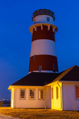 Fototapeta na wymiar lighthouse on the sea at sunset