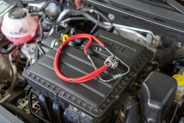 Stavropol Russia 05 07 2019 Car engine MPI with stethoscope. Health car engine inspection. Motor...