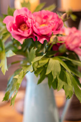 Pink peonies in turquoise ceramic vase