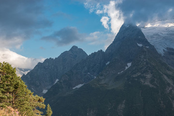 Panorama of mountains and forest scene in national park of Dombay, Russia