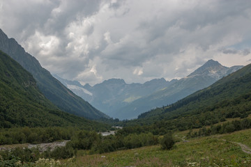 Fototapeta premium Panorama view on mountains with river scene in national park of Dombay