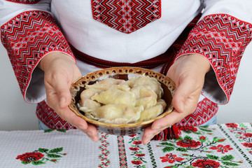 The cooked traditional Ukrainian hand-made vareniki (dumpling) with cherry inside