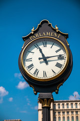 Fototapeta na wymiar Public clock in front of parliament in Bucharest, capital of Romania